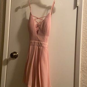 soft pink romper with crisscross in front